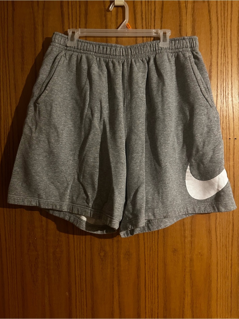 Nike Gray Athletic Shorts with White Swoosh Accent